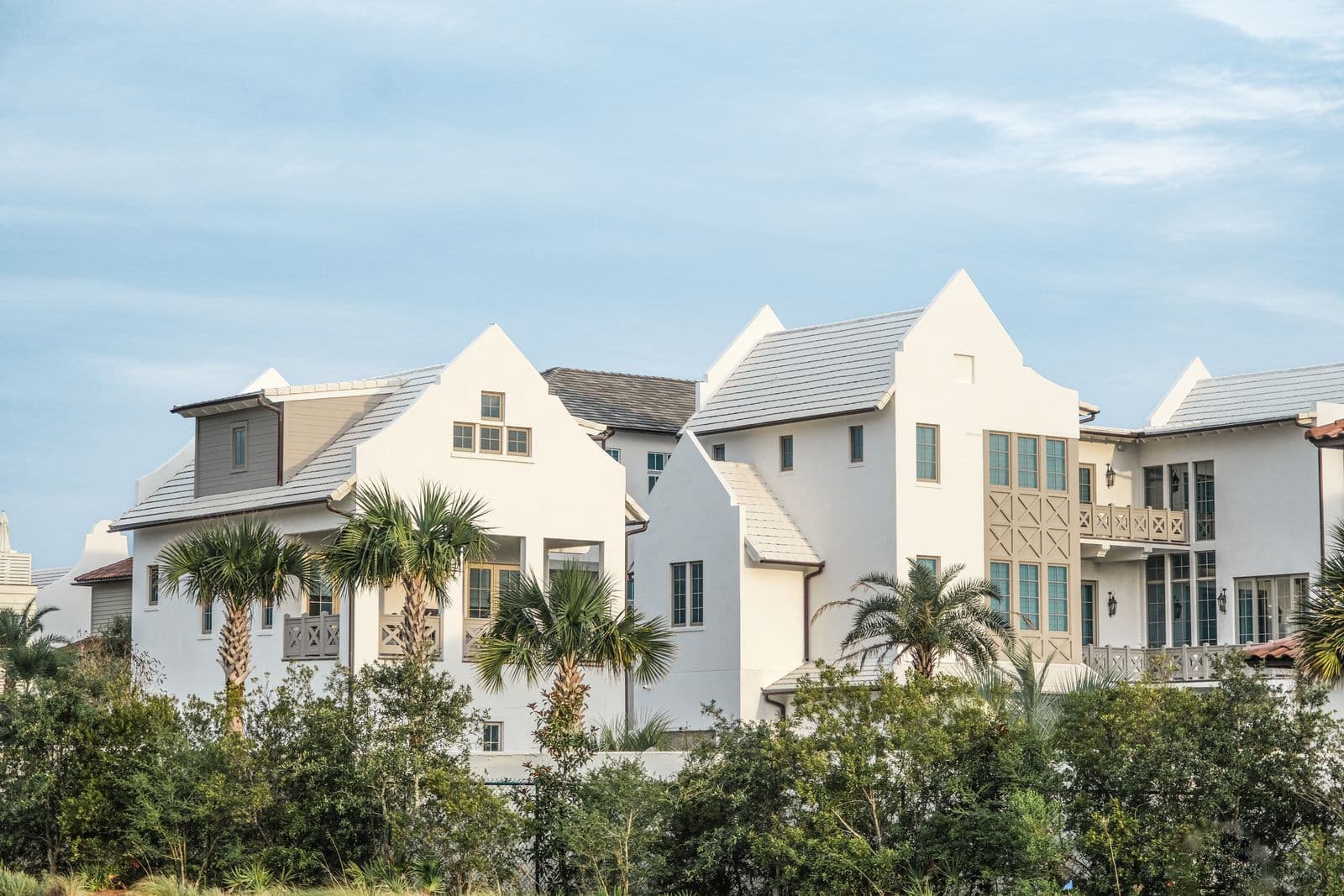 White homes with palms in a master-planned Florida community