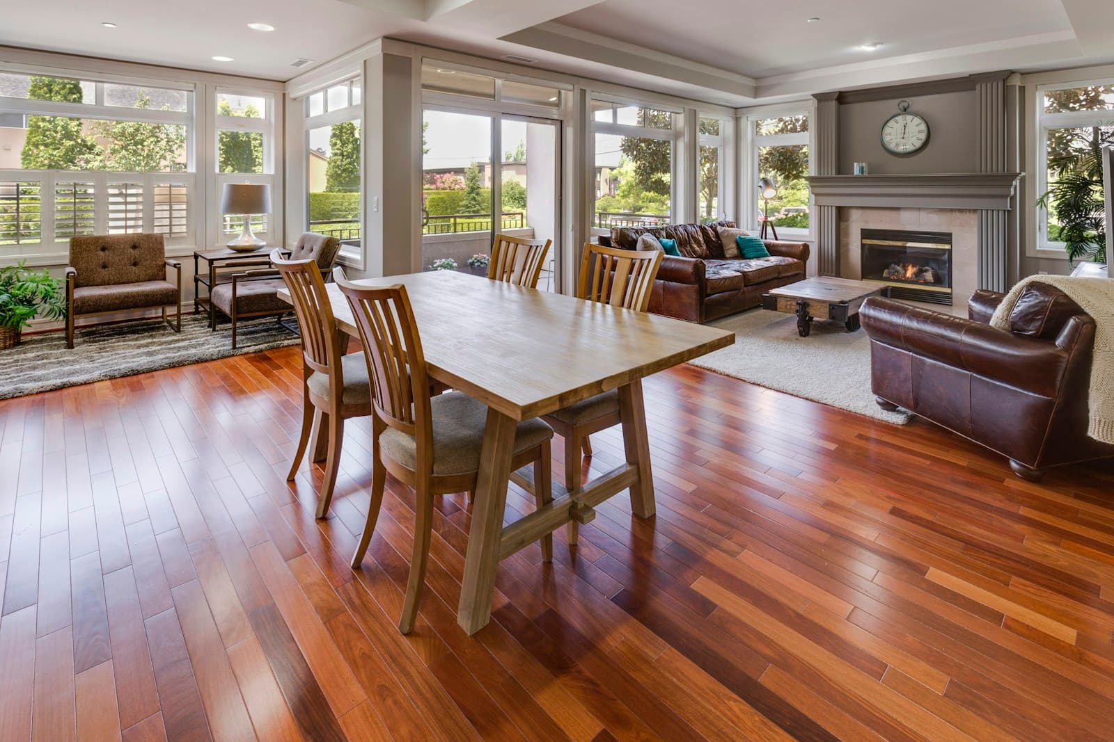 Bright open room with polished hardwood floors and a dining table